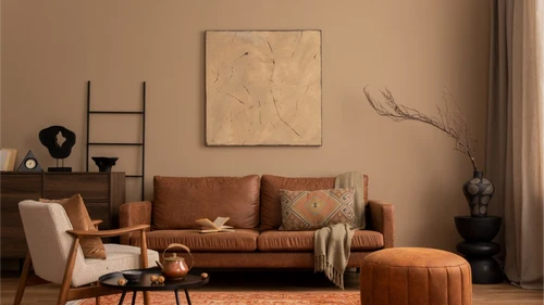 Diamond Paints room wise advisory banner featuring warm beige living room with brown leather sofa